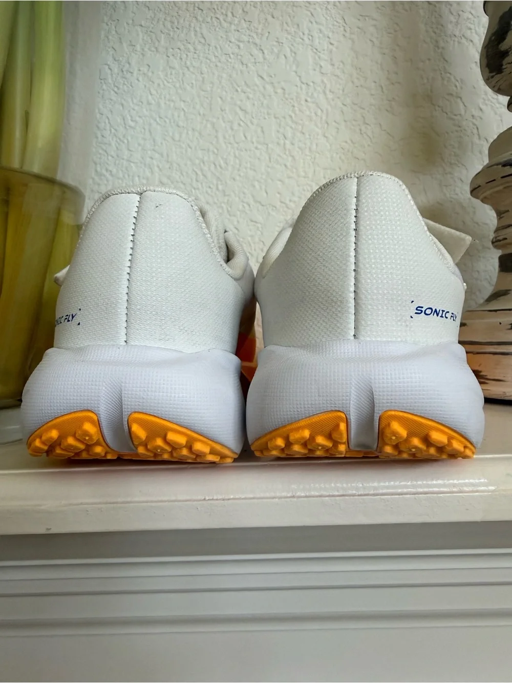 Nike Kids White Sneakers with Orange Toe and Blue Accents